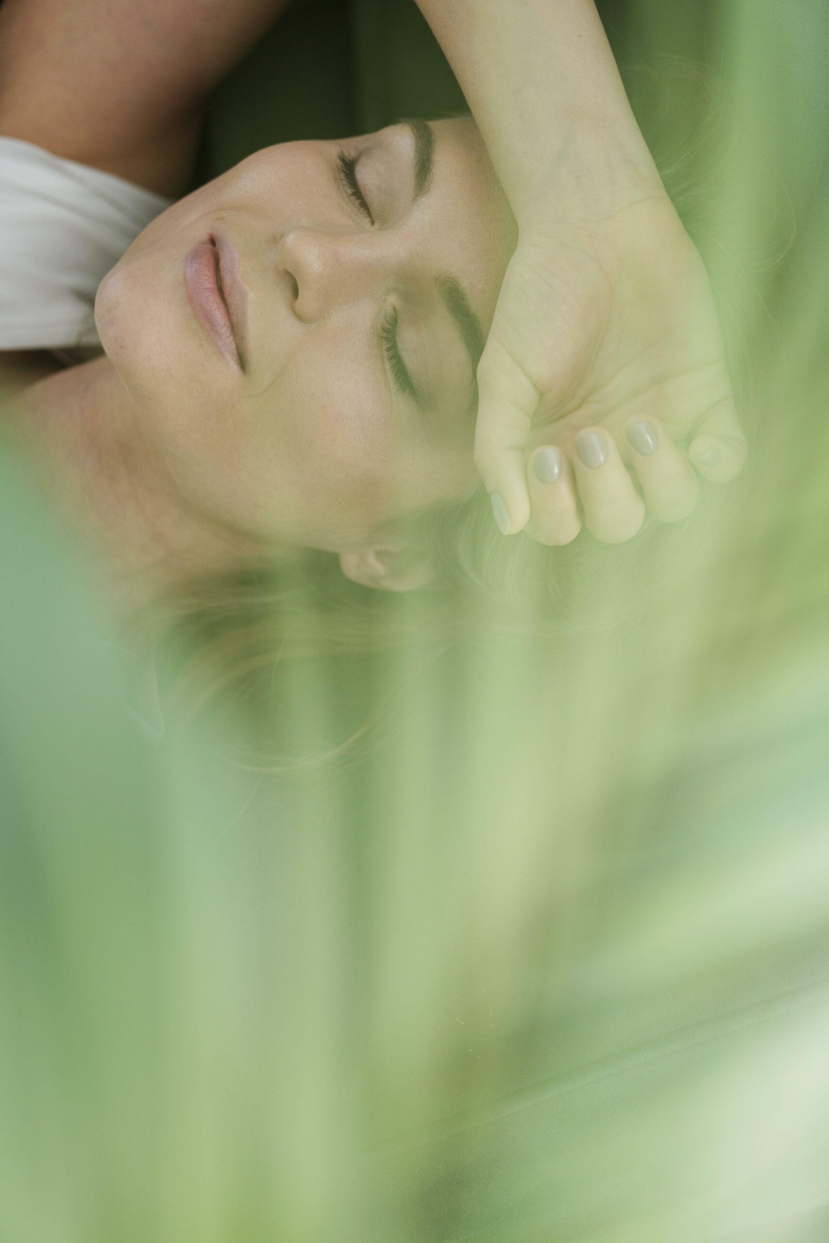 daydreaming-woman-blurred-house-plant